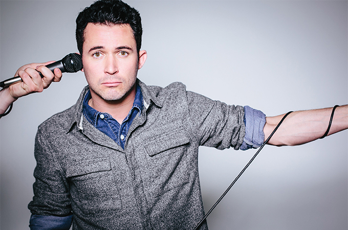 Justin Willman on stage